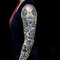 Arm Black & Grey Flowers Skull Sleeve Tattoo
